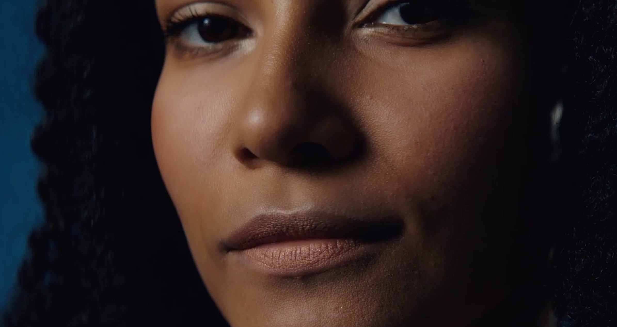 Close-up of a woman's thoughtful expression.