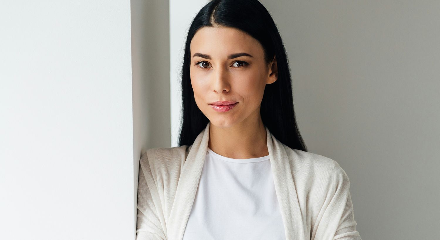 Portrait of a woman with long black hair.